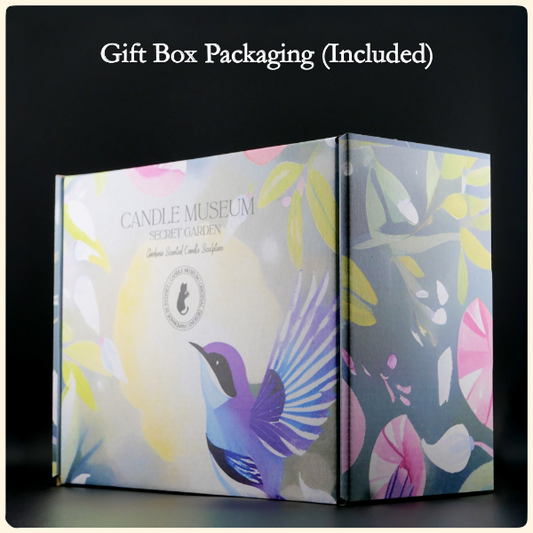 Candle Museum Secret Garden candle packaging with floral design and bird illustration on a black background.