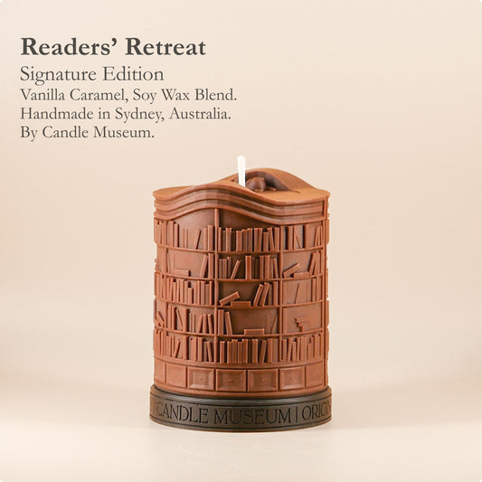 Candle shaped like a bookshelf with 'Candle Museum' branding on a beige background