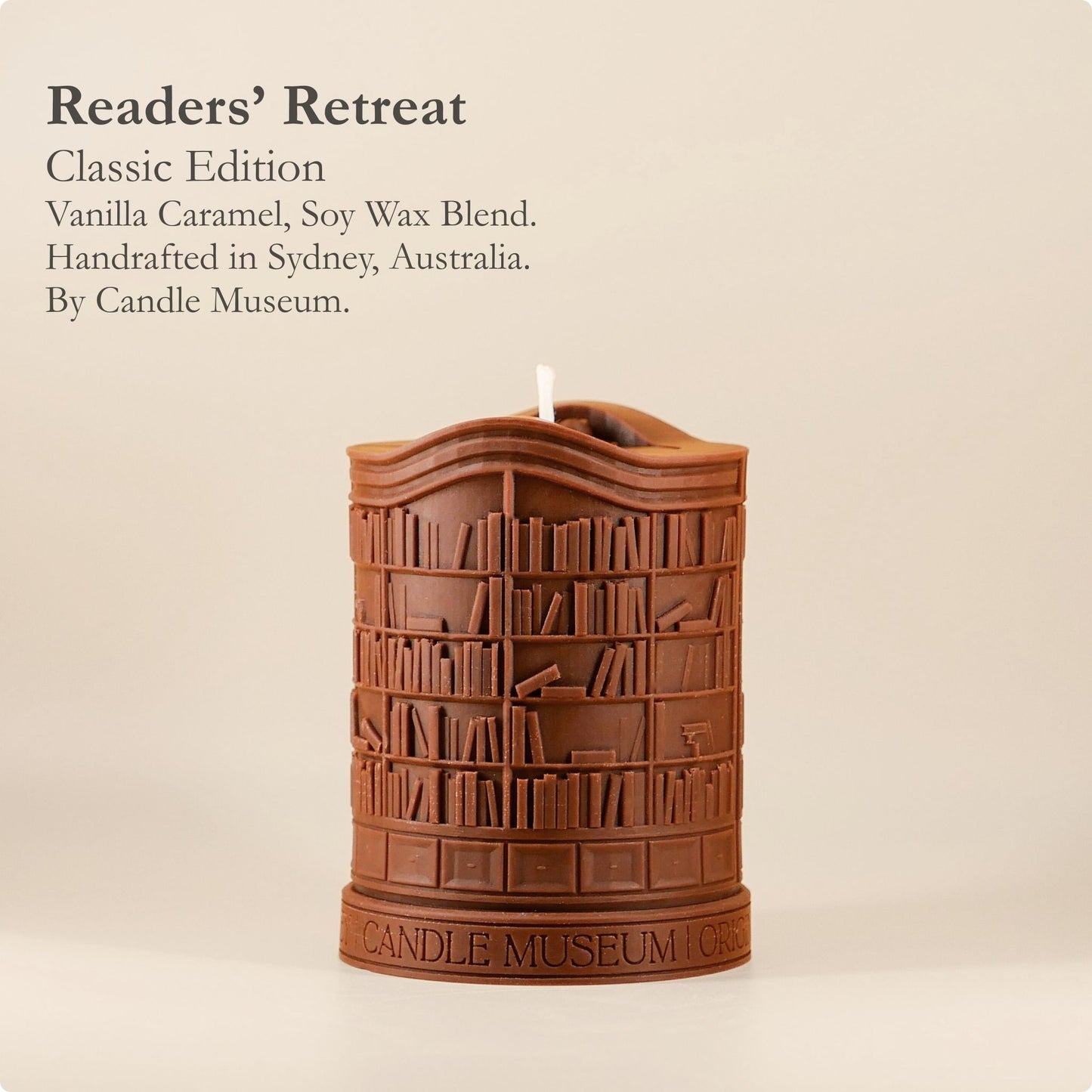 Candle shaped like a bookshelf with 'Candle Museum' branding on a beige background