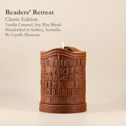 Candle shaped like a bookshelf with 'Candle Museum' branding on a beige background