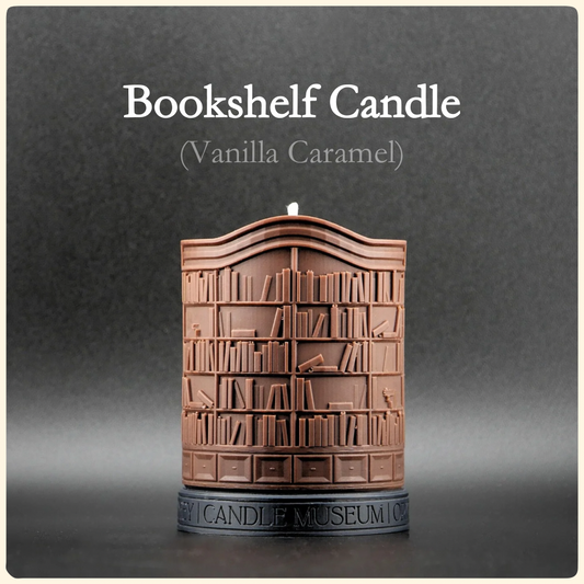 Bookshelf candle with 'Vanilla Caramel' scent on a gray background